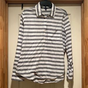 Nice grey and white striped blouse with front pocket.
